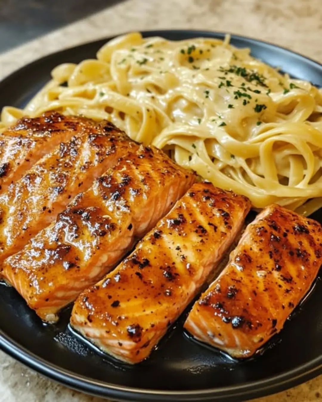 Cajun Honey Butter Salmon Bites Over Cheesy Creamy Linguine